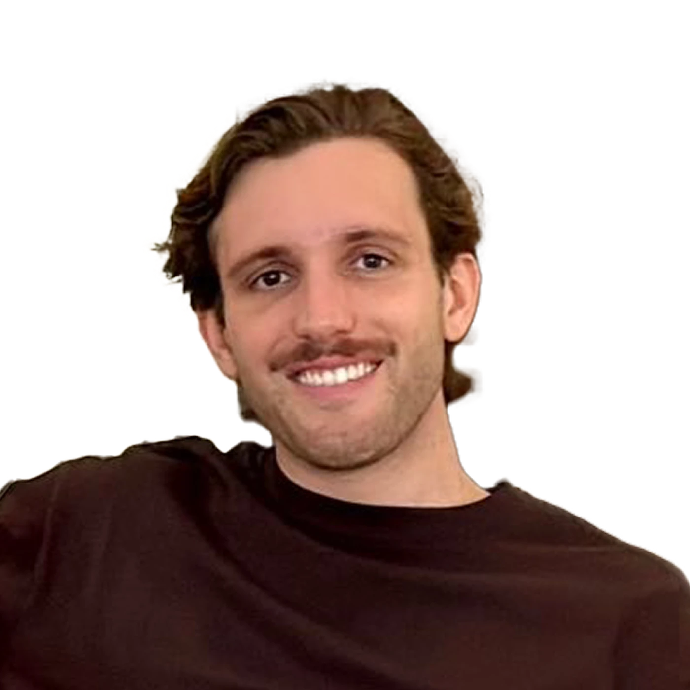 Smiling man with wavy hair and a beard, wearing a black shirt, against a plain background.