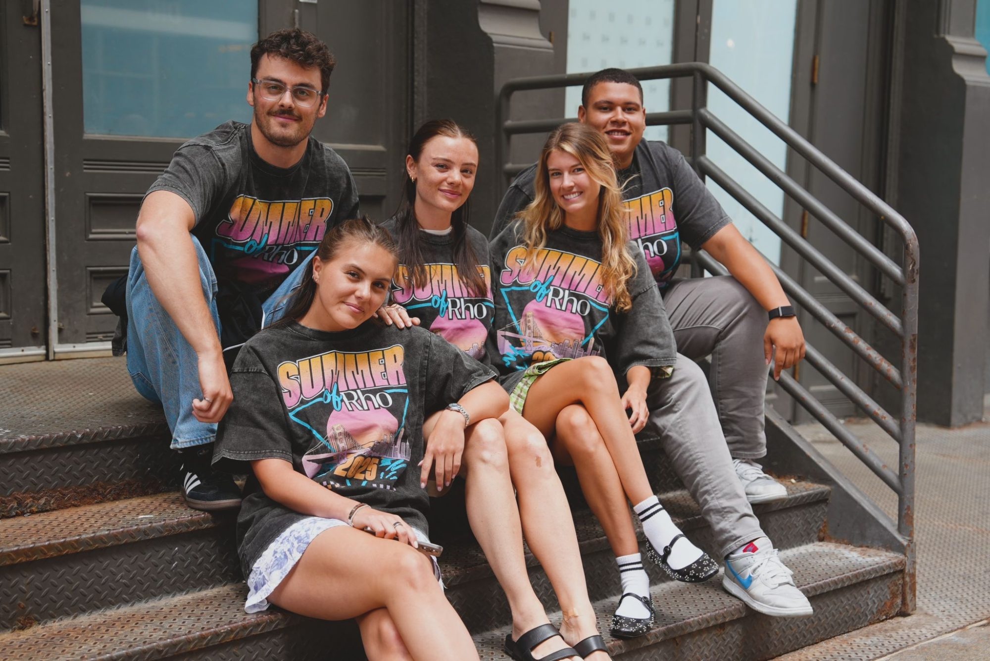 The team in Summer by Rho tees on a SoHo stoop