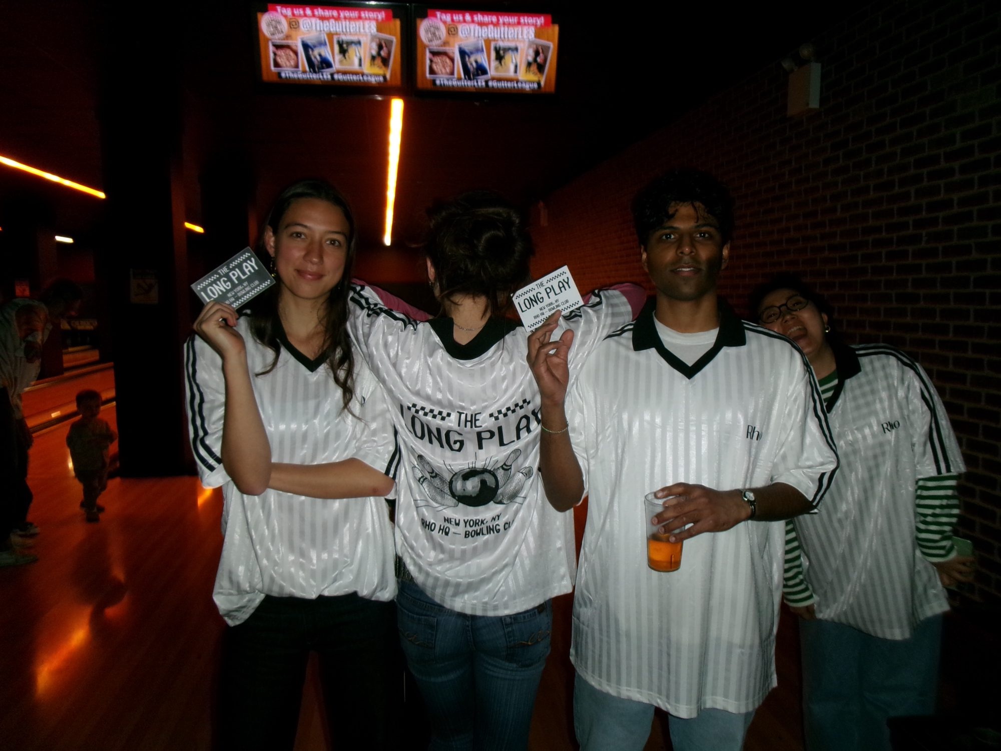 Rho teammates with tickets at the Long Play bowling night