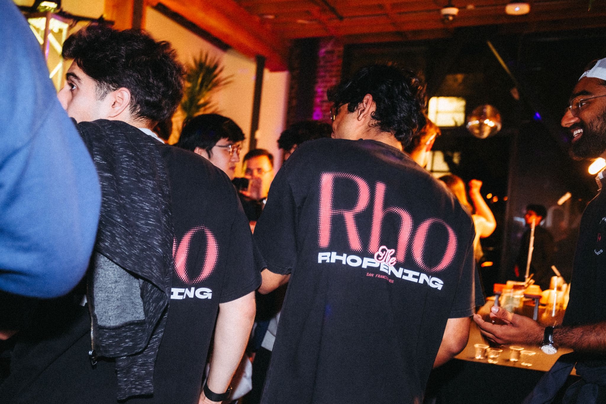 Rho tees in the crowd at the Rhopening party