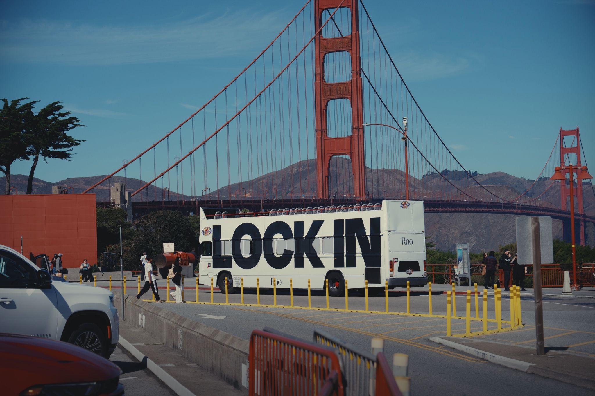 Rho LOCK IN bus in front of the Golden Gate Bridge