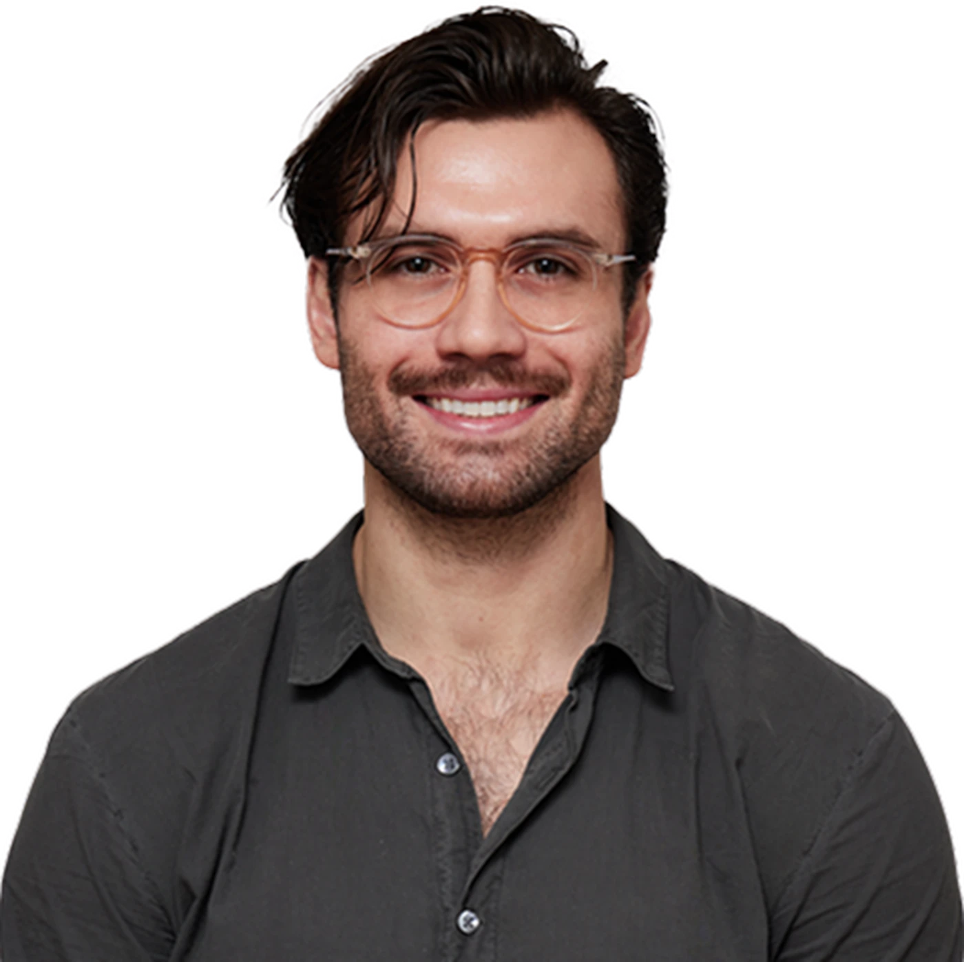 Smiling man with glasses and dark hair, wearing a dark button-up shirt, against a white background.