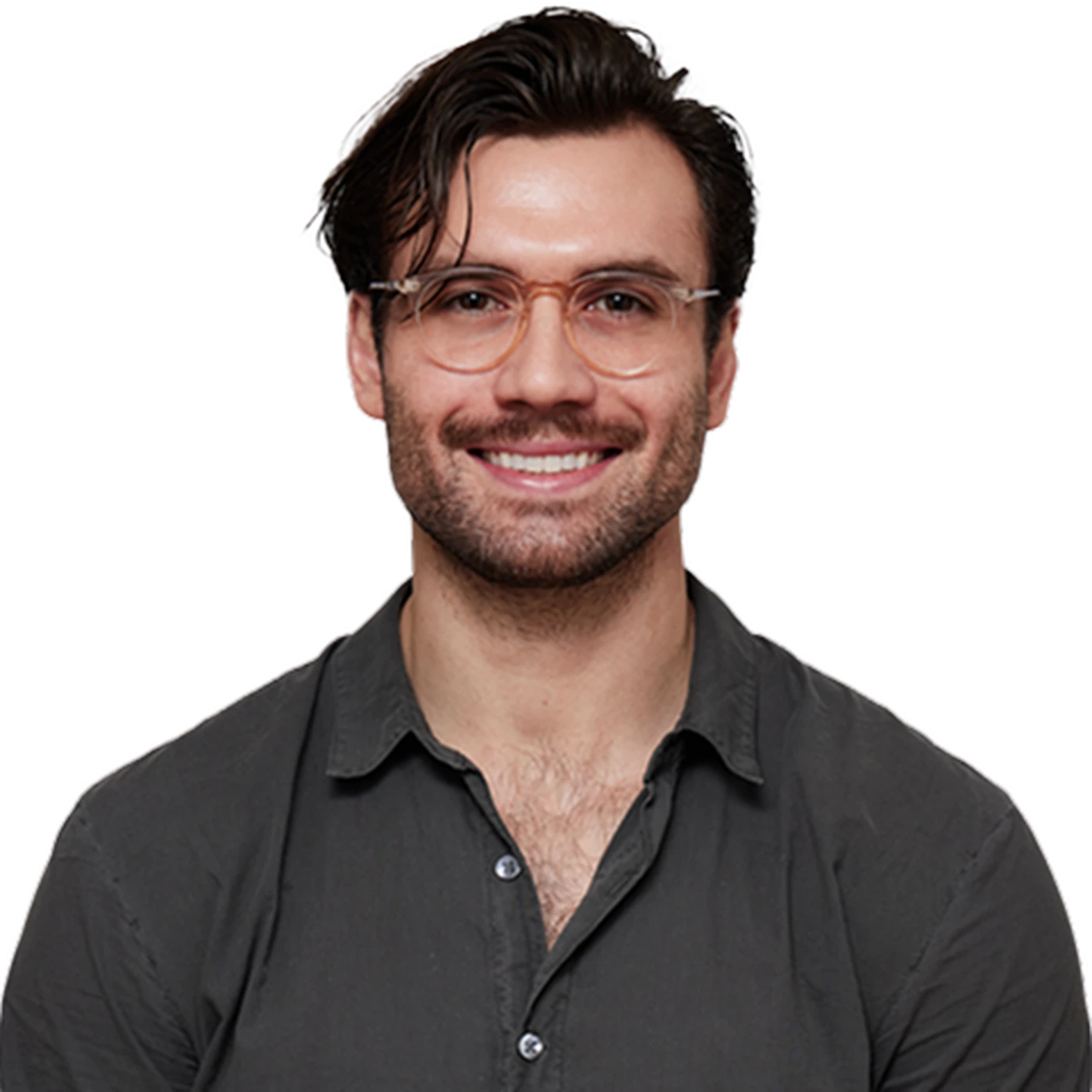 Smiling man with glasses and dark hair, wearing a dark button-up shirt, against a white background.