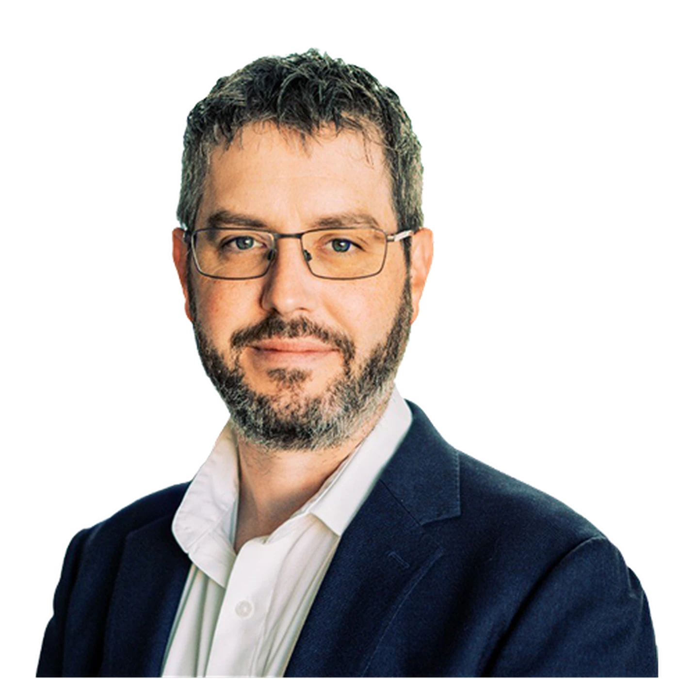 Man with glasses and a beard wearing a white shirt and dark blazer, smiling slightly against a plain background.