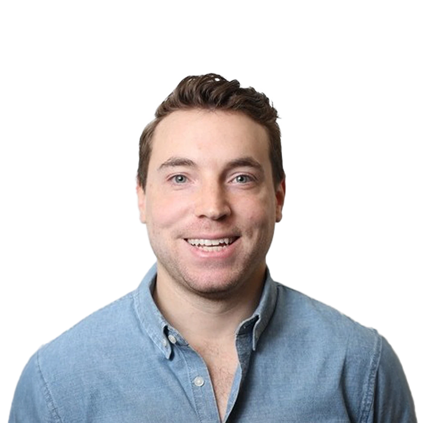 Smiling man with short hair wearing a light blue button-up shirt against a plain white background.