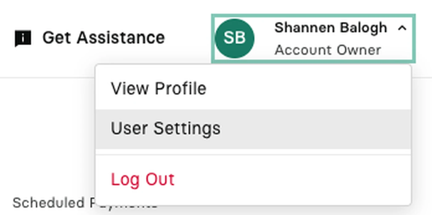 Dropdown menu showing options: View Profile, User Settings, and Log Out. "User Settings" is highlighted in the dropdown menu under the profile