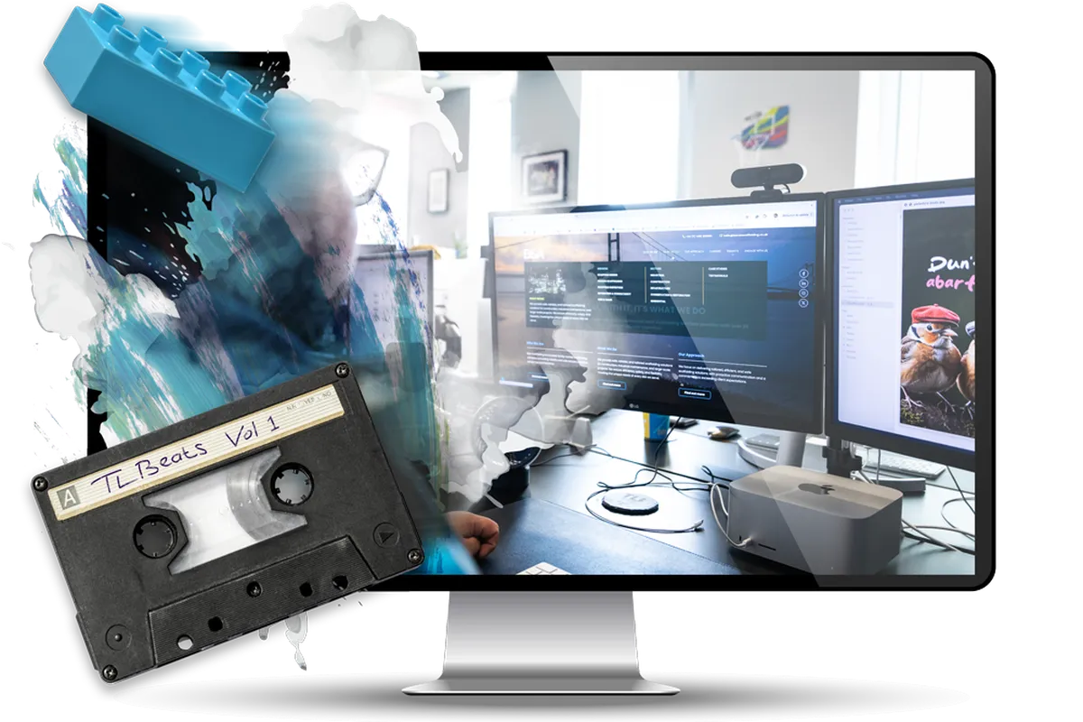 A computer monitor displaying a blurred image with a cassette labeled "TL Beats Vol 1" and a blue LEGO brick.