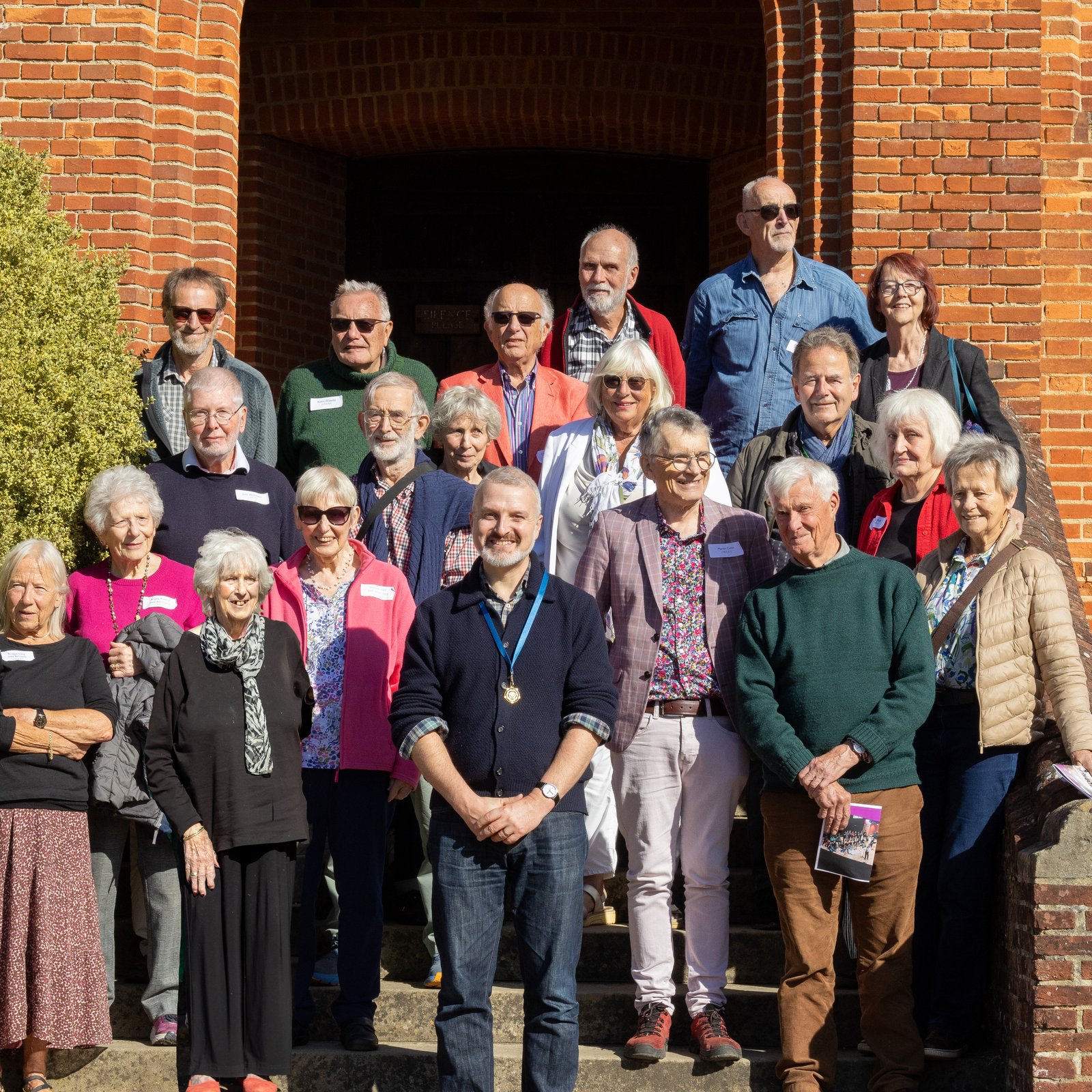 Bedales alumni standing on Memorial Library steps