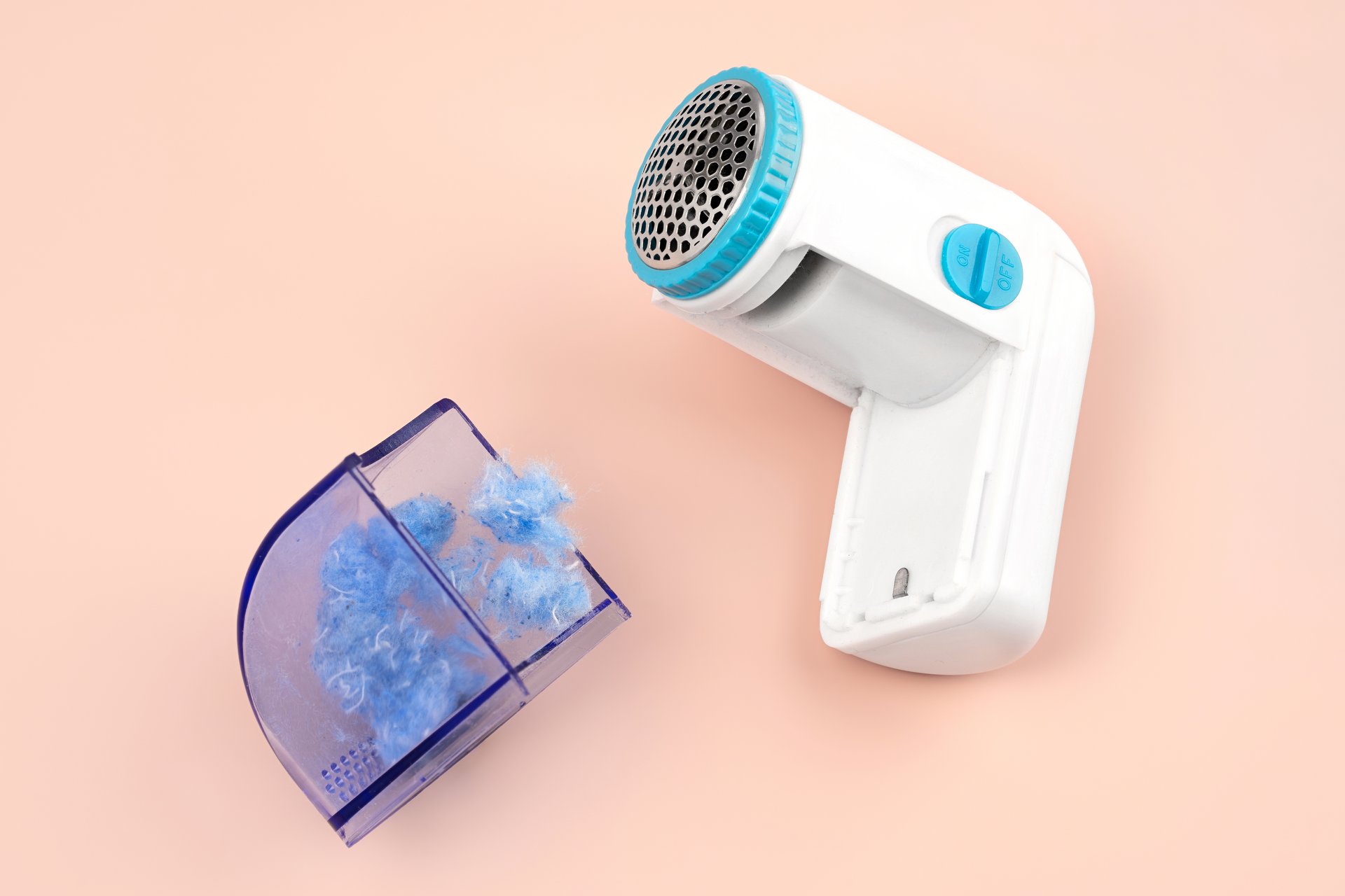 Hoe verwijder ik pluisjes van mijn jas?