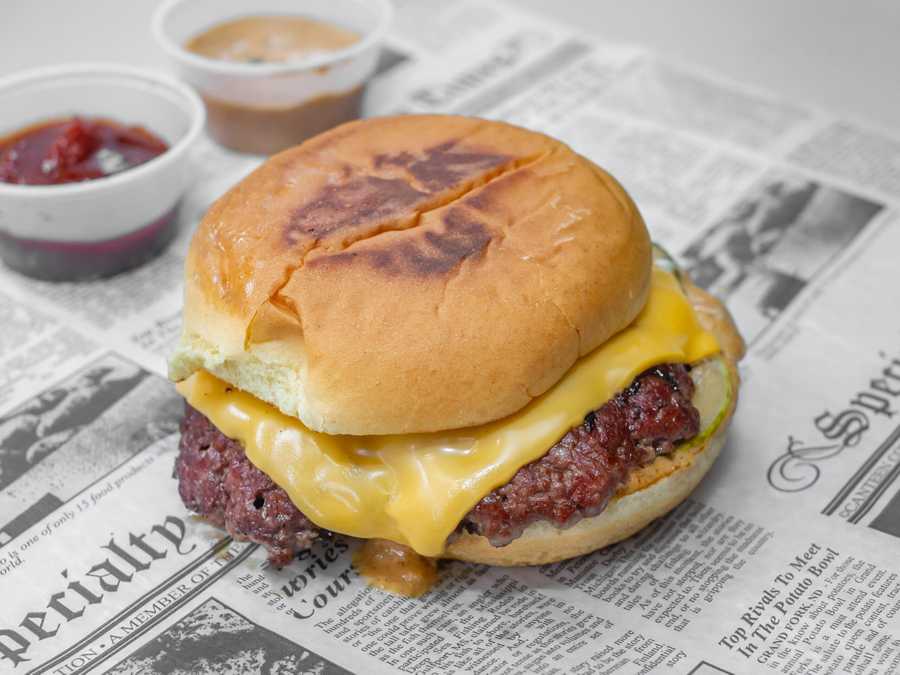 Image of Burgers on B Smash Burger on newspaper wrapper