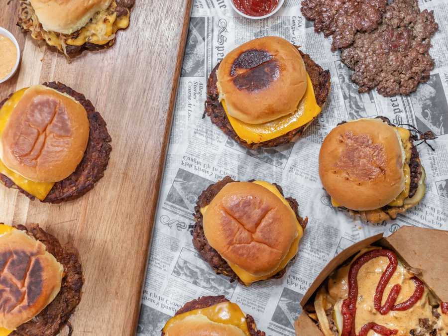 Image of Burgers on B table full of burgers and loaded fries