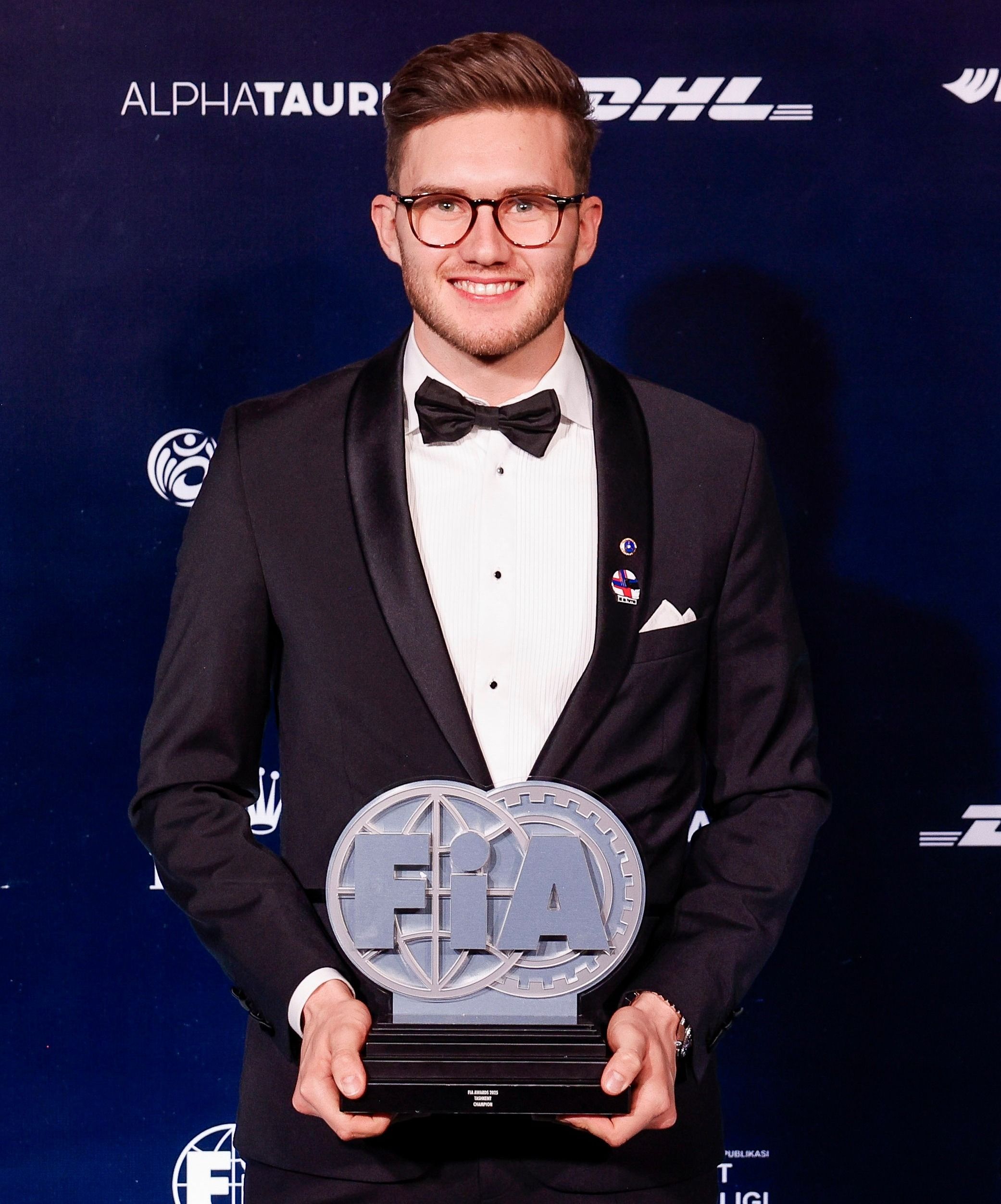 Kevin Hansen receives the 'Action of the Year' trophy during the 2025 FIA Awards Ceremony in Tashkent, Uzbekistan (2)