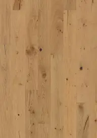 Light brown wooden floor with natural grain patterns and small knots.