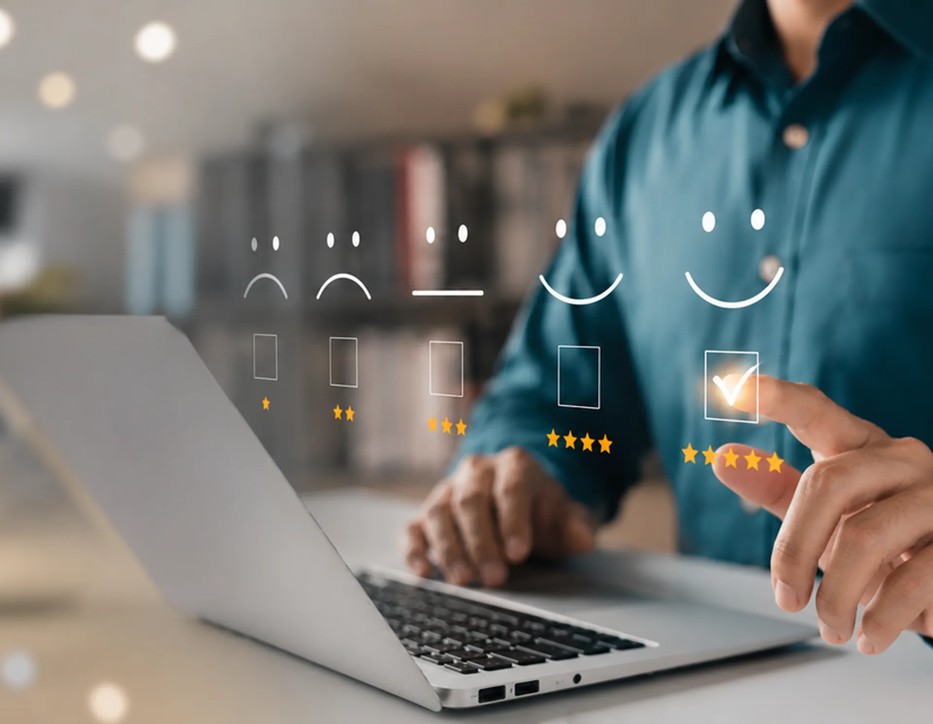 Person rating their customer experience with smiley faces and stars over a laptop