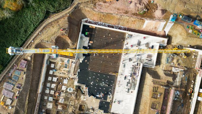 Overhead view of a tower crane working on the site of a new hospital on the outskirts of Cardiff