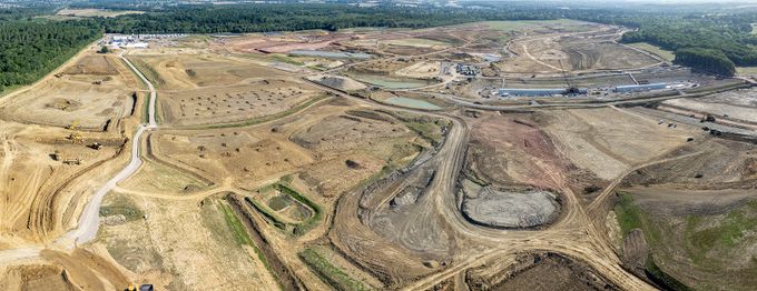 Aerial view of a Havant Thicket construction site with winding access roads, excavation pits.