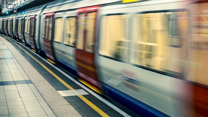 Train passing through underground station