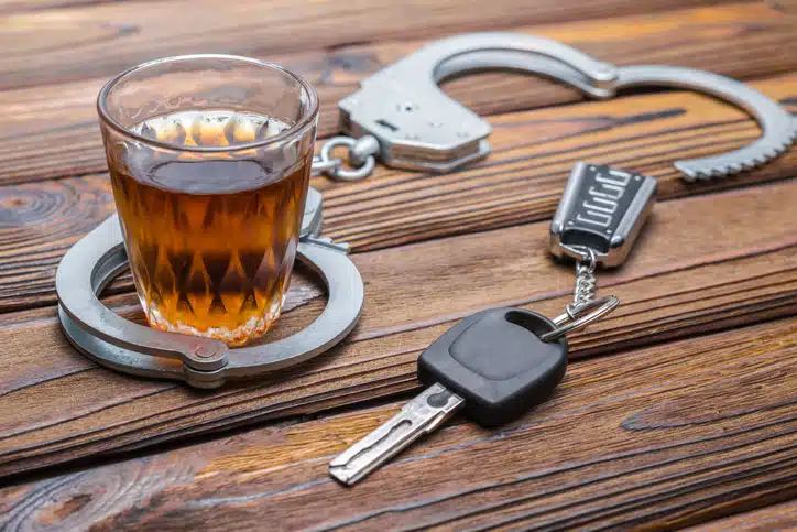 Drink with key and handcuffs