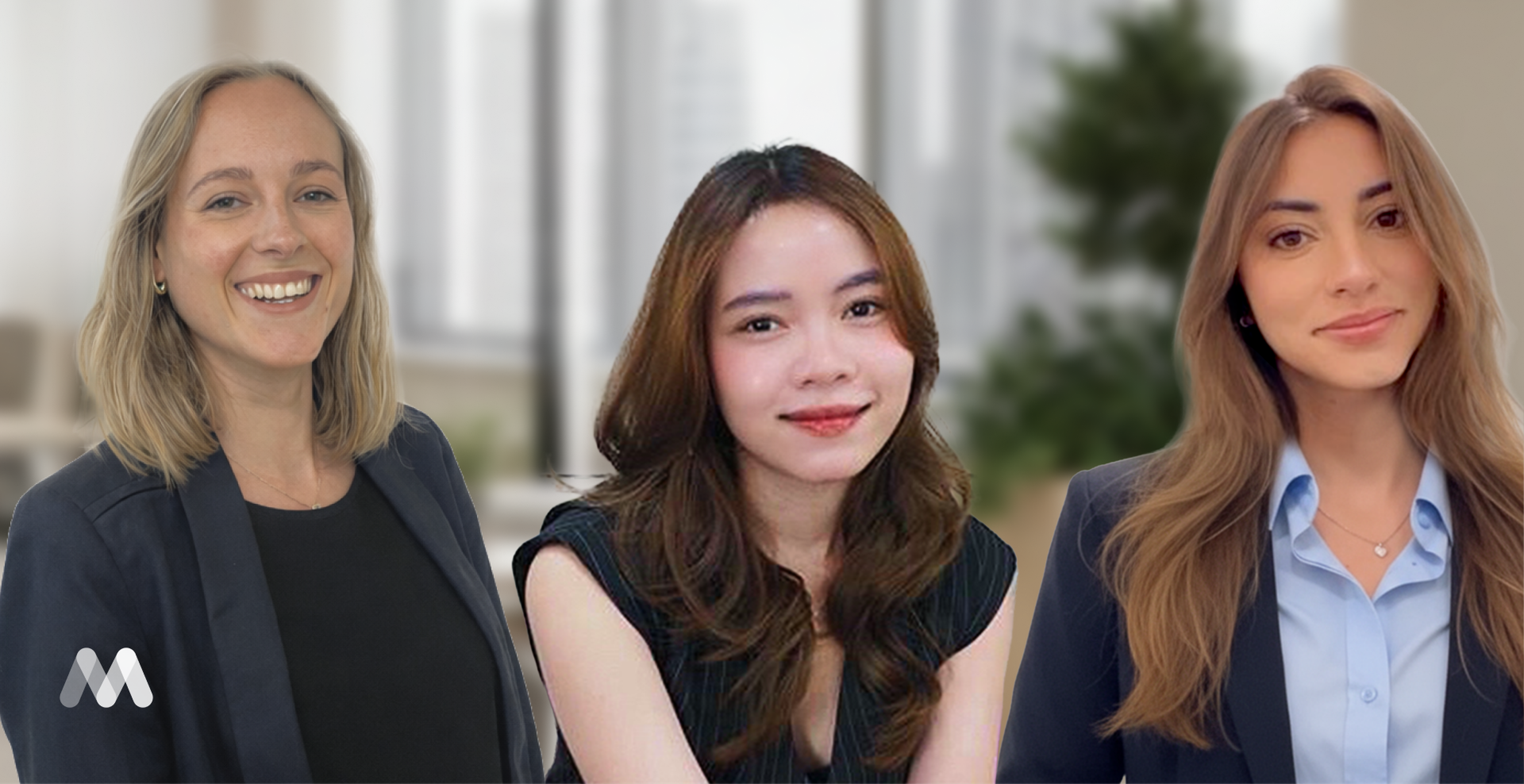 Three women in business attire smiling in an office setting, with a blurred background and a logo in the corner.