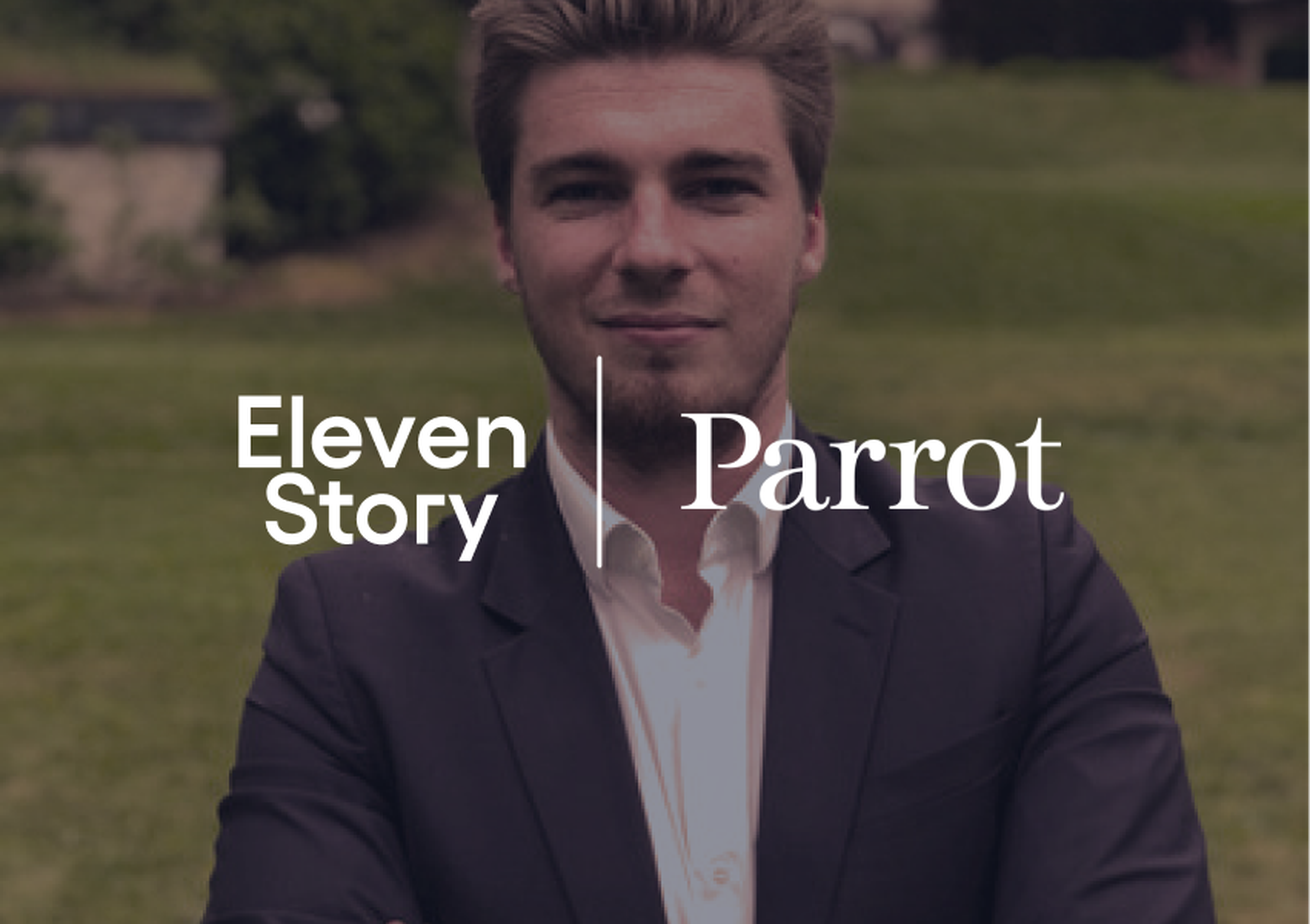 A man in a suit standing outdoors with the words "Eleven Story Parrot" overlaid on the image.