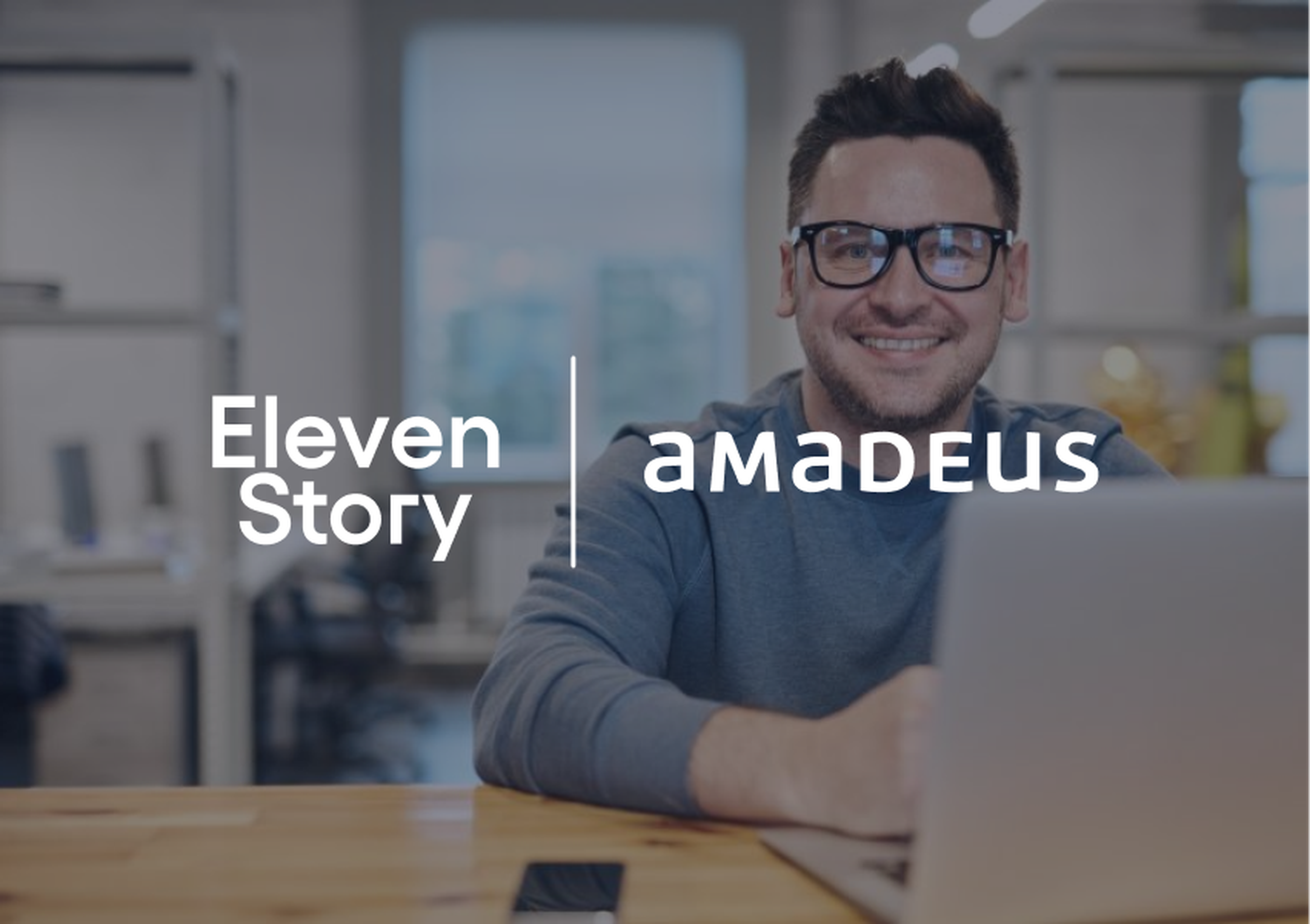 A smiling man wearing glasses works on a laptop at a wooden table, with logos of "Eleven Story" and "amadeus" overlaid on the image.