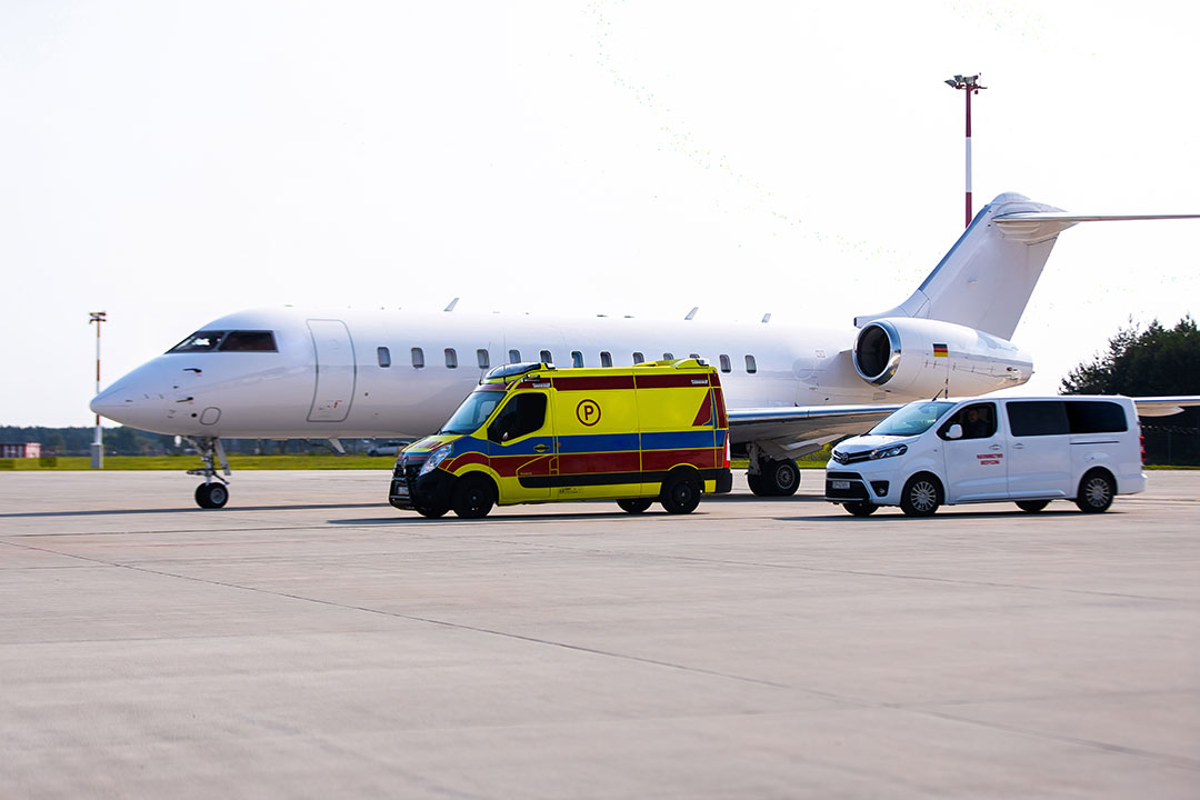 Air and Ground ambulance on the tarmac of an airport