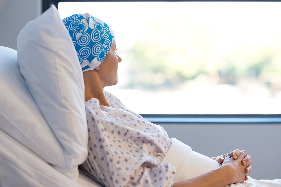 A cancer patient looking at the window A cancer patient looking at the window