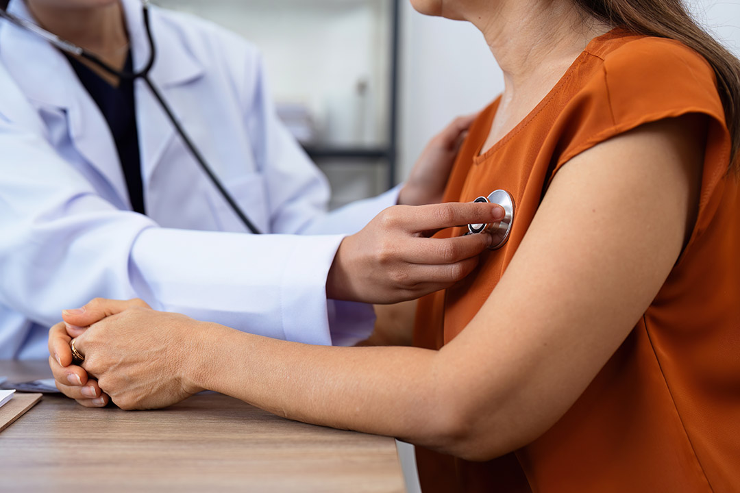 A doctor checking a heart condition
