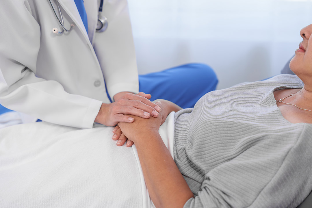 A doctor reassuring a patient