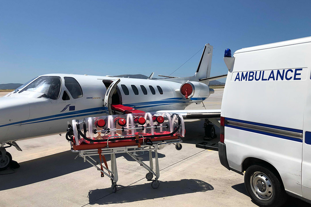A medical jet next to a ground ambulance