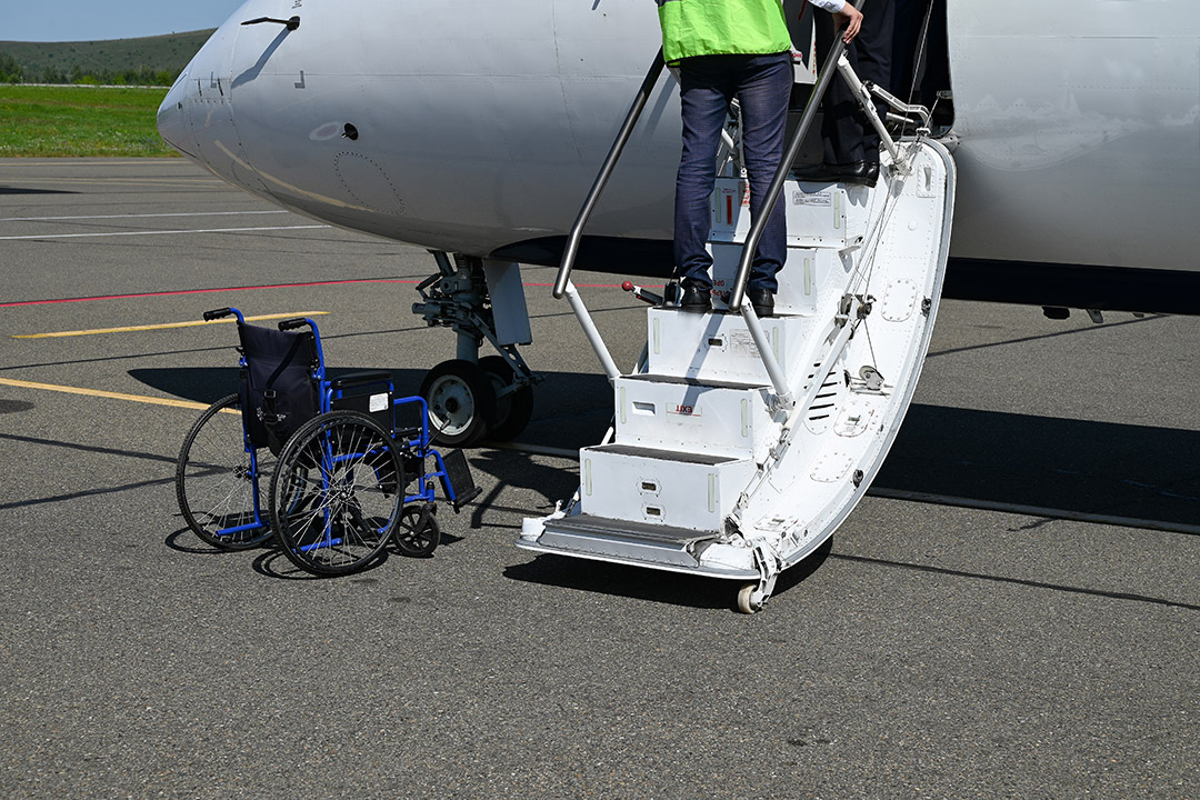 A medical escort providing boarding assistance