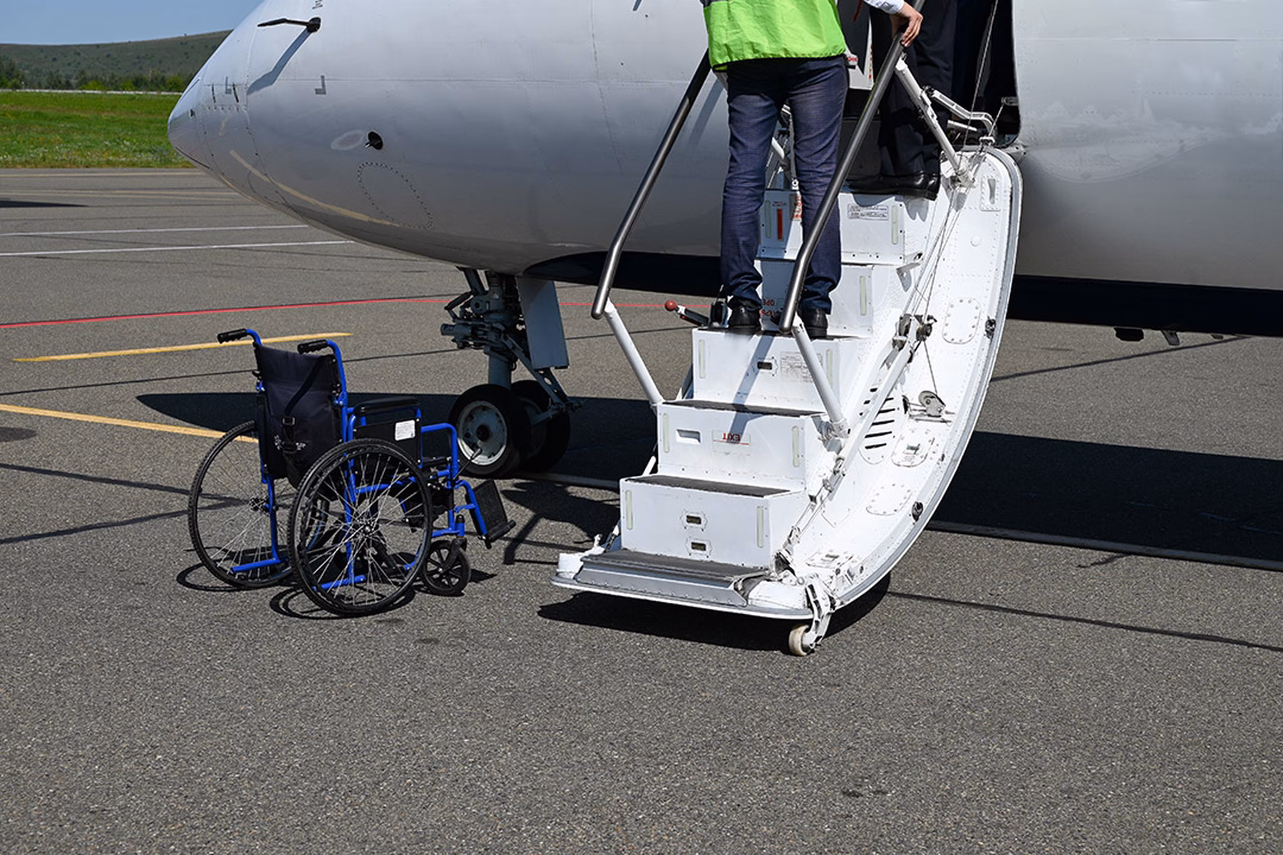 A medical escort providing boarding assistance