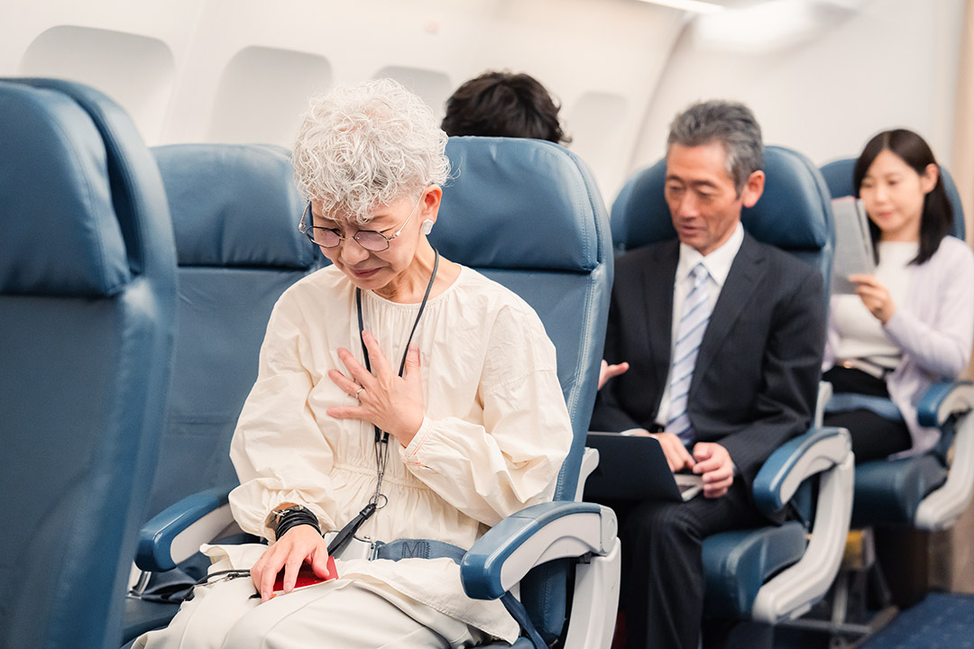 Individuals in the passenger cabin of a commercial airliner