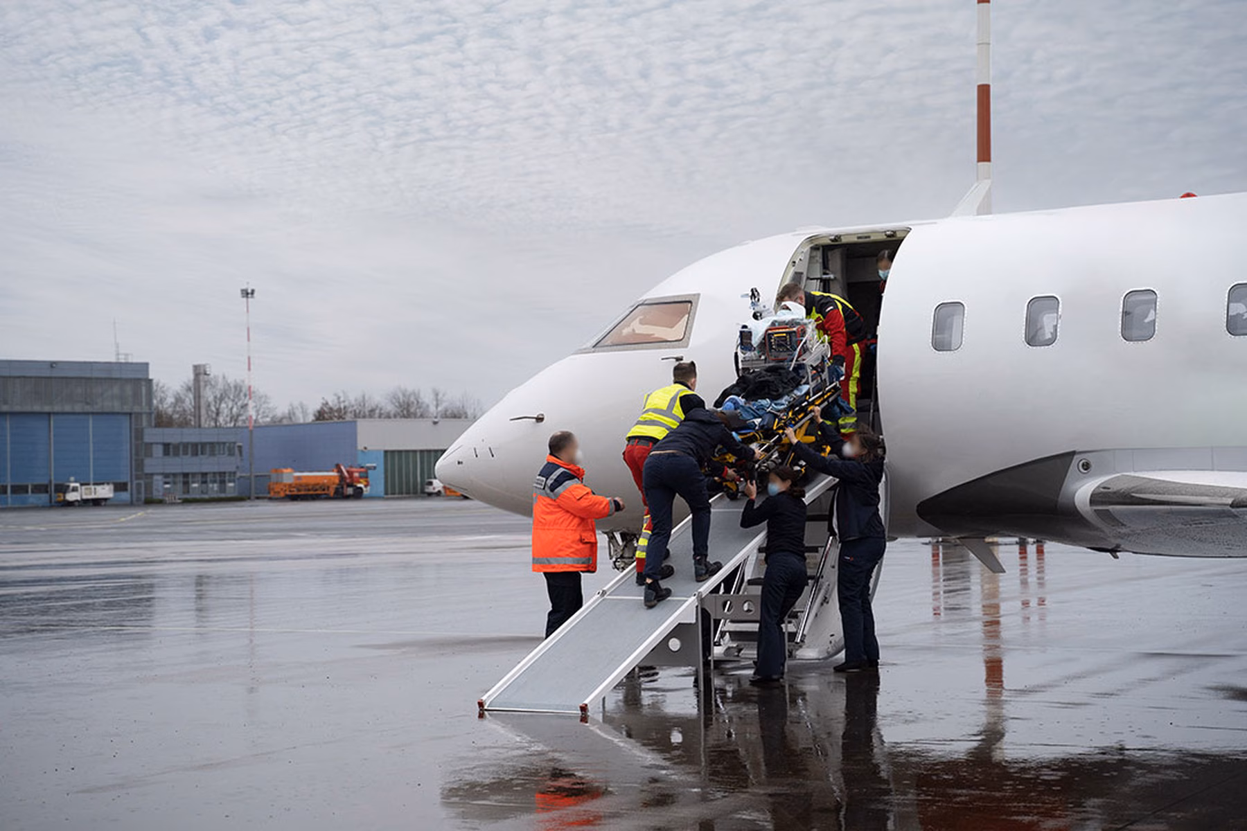 Patient being placed on board an air ambulance