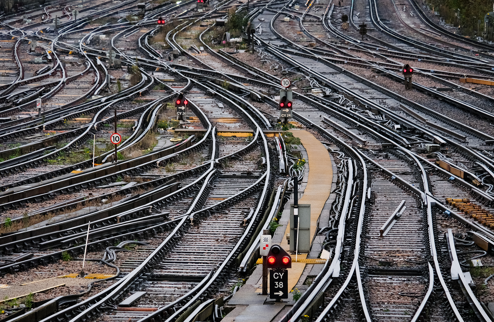 Complex railway tracks with multiple intersections and signals, creating an intricate network.