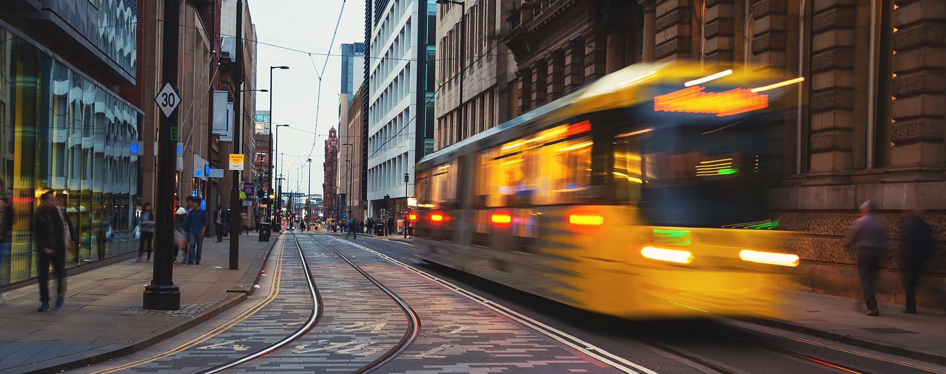 A tram moving through city streets