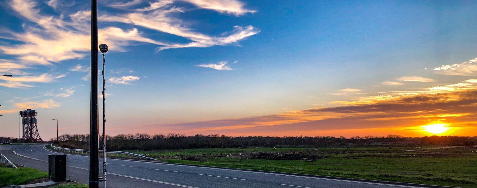 A shot of the ANPR system with a sunset background.
