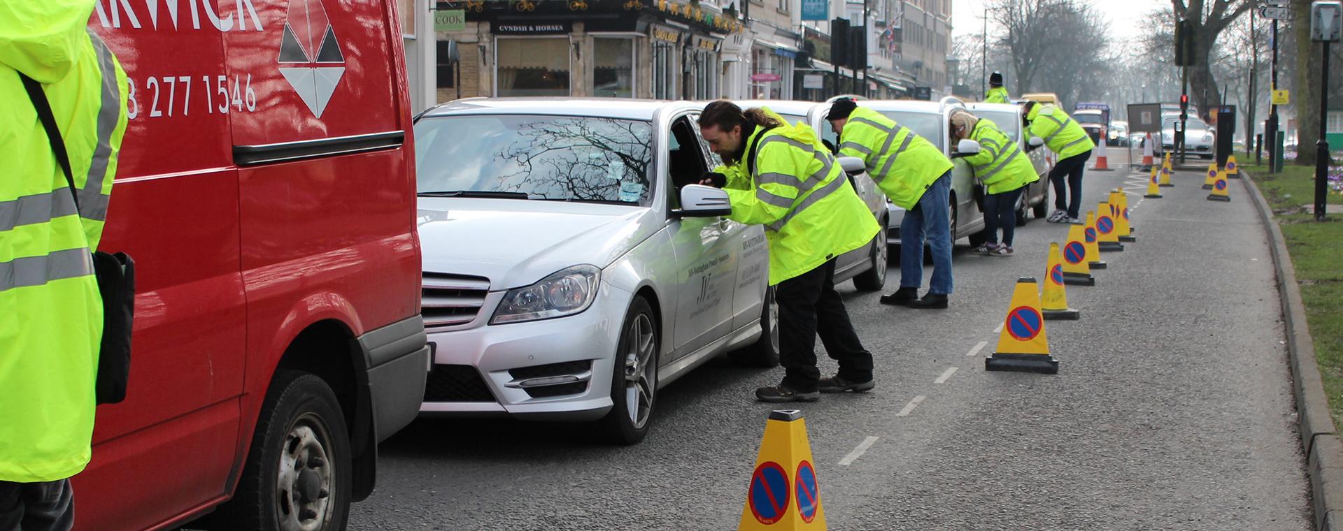 Motorists queueing at a survey