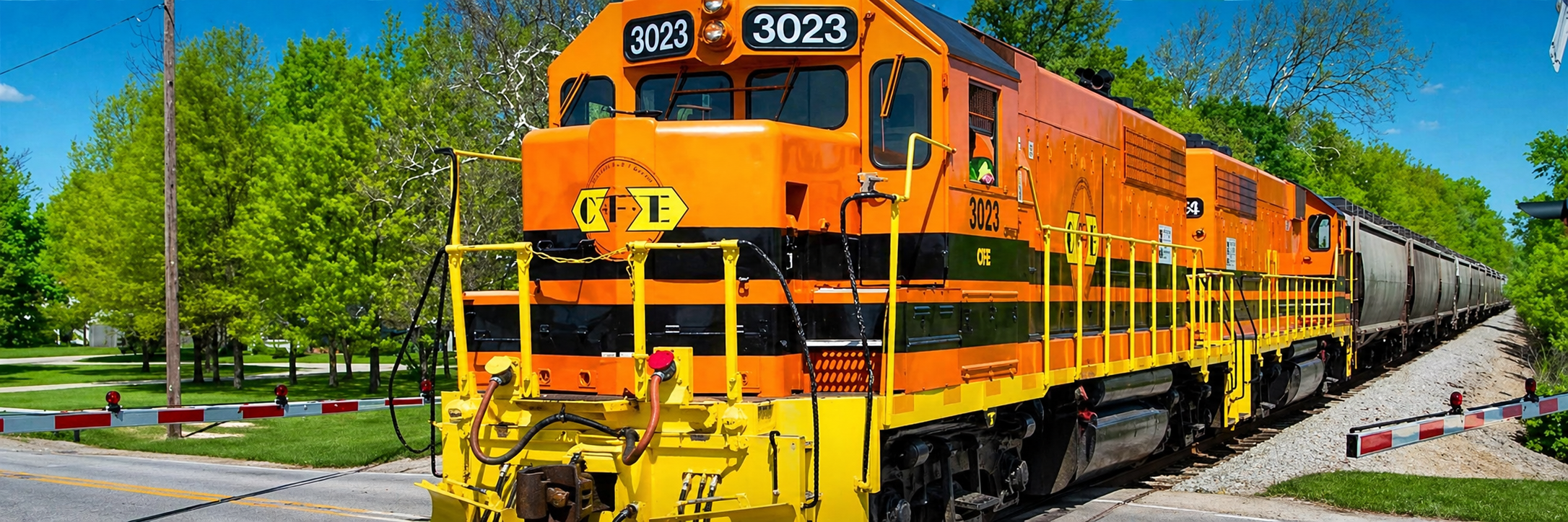 A train on a railroad on a sunny day