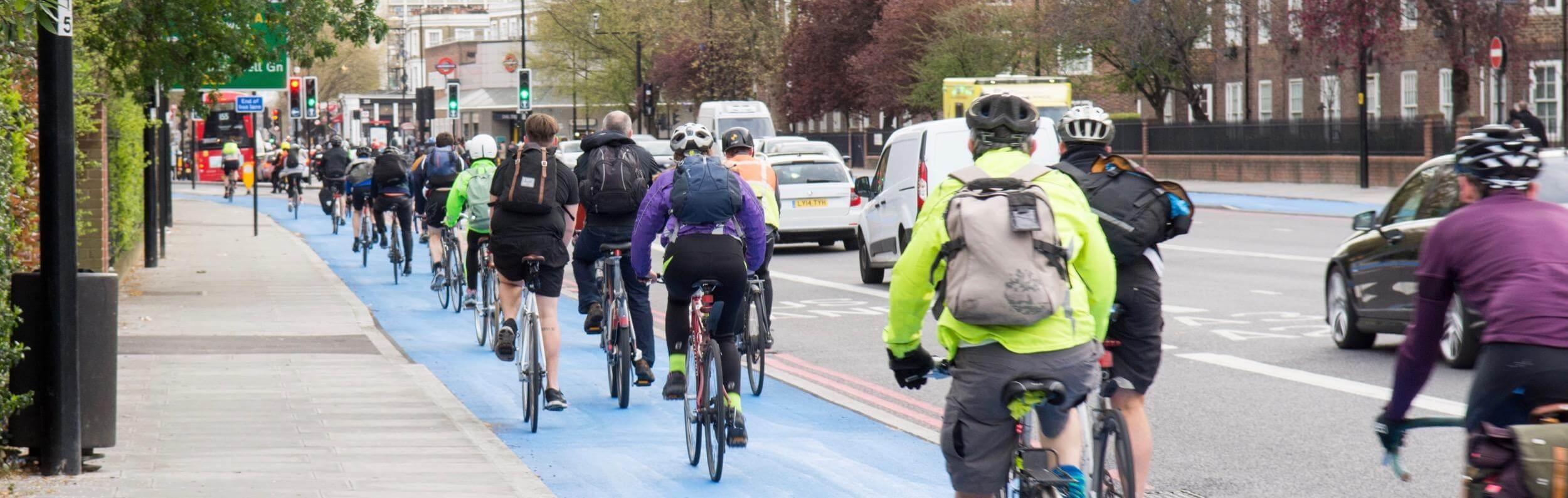 A large amount of cyclists using the bike lane.
