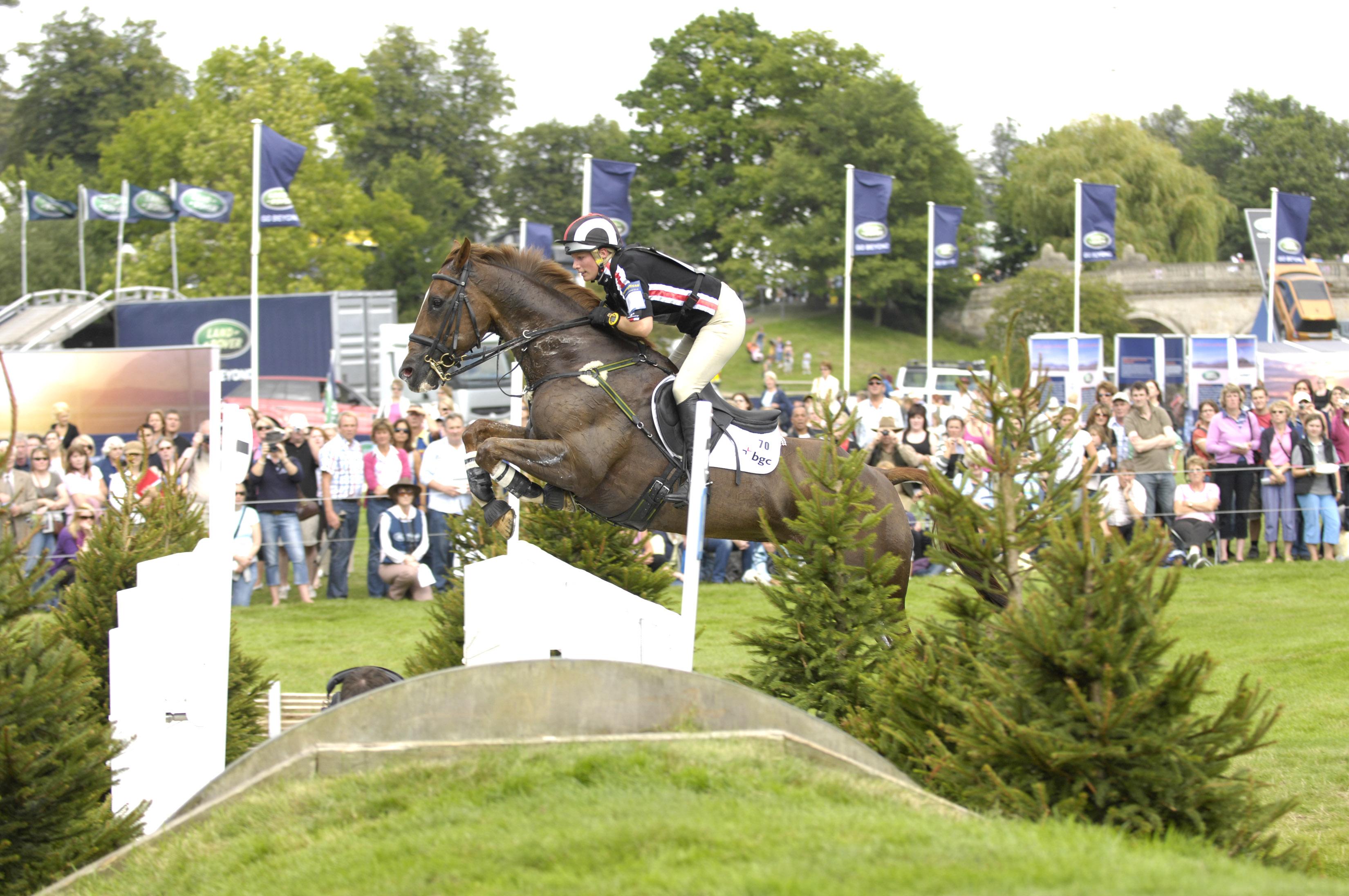 A horse jumping a fence at Burghley Horse Trials