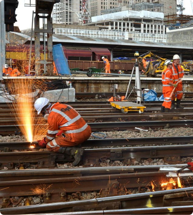rail workers working on a rail track