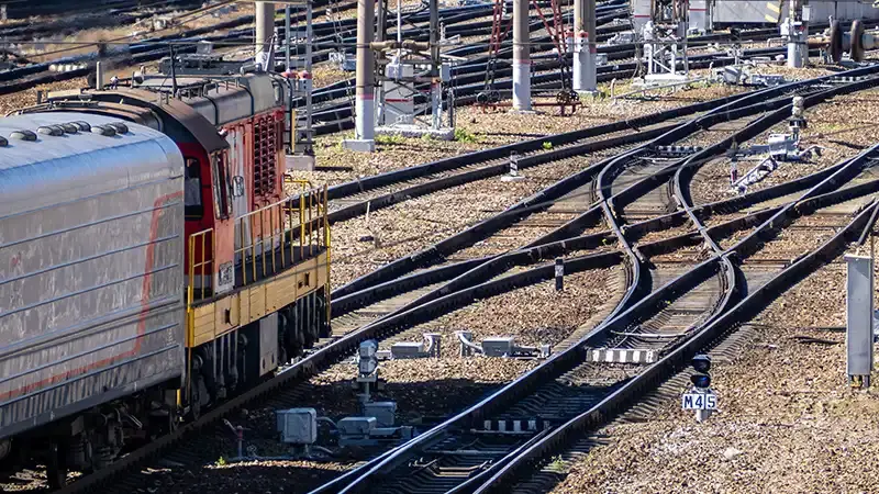 A train on the railroad approaching signals and points