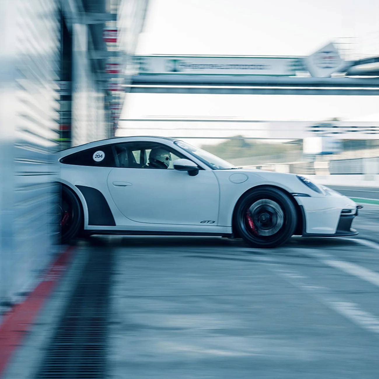 Porsche exiting pit-box on a track day