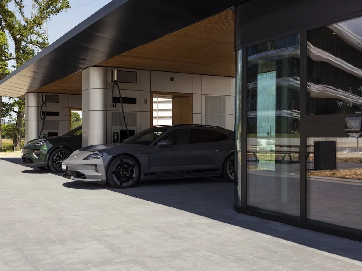Two Porsches being charged in a charging lounge