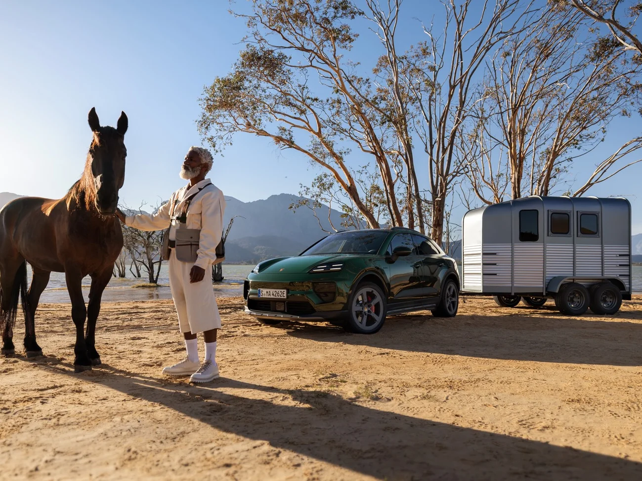 Several dynamic shots of an Oak Green Metallic Neo Macan 4S driving through the desert. (Confidential image)