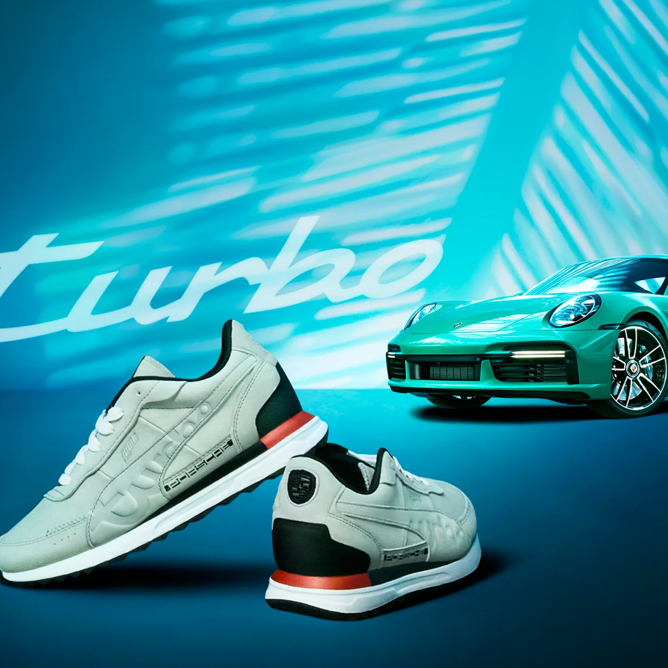 A pair of shoes in front of a Porsche racing model