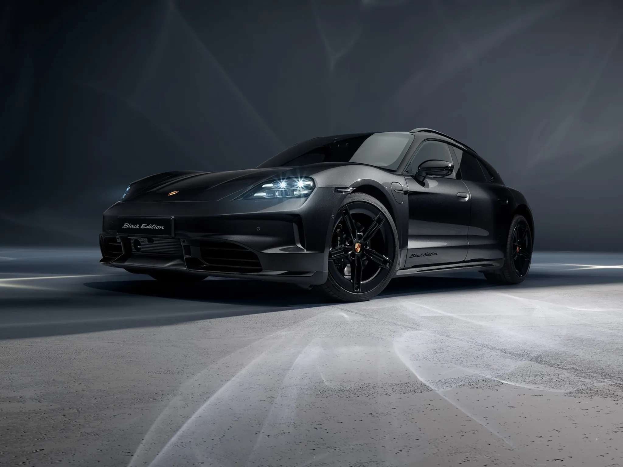 A rear image of a Porsche Taycan Black Edition.