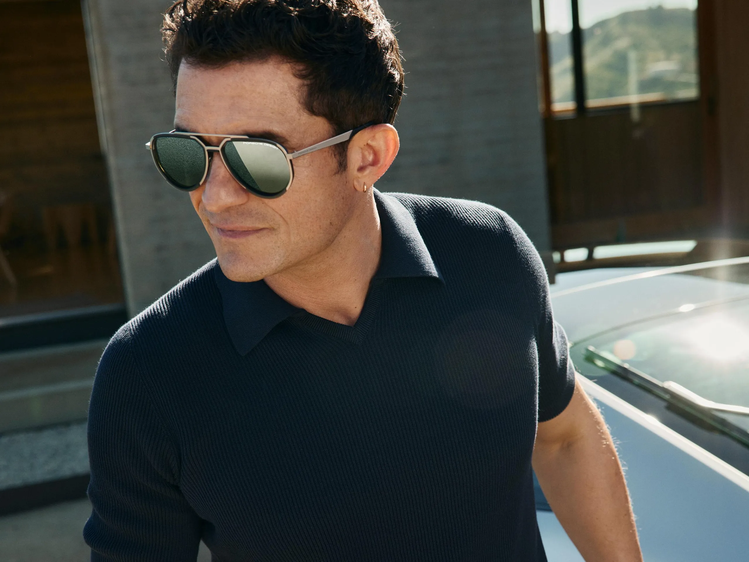 Orlando Bloom wears sunglasses from Porsche Design