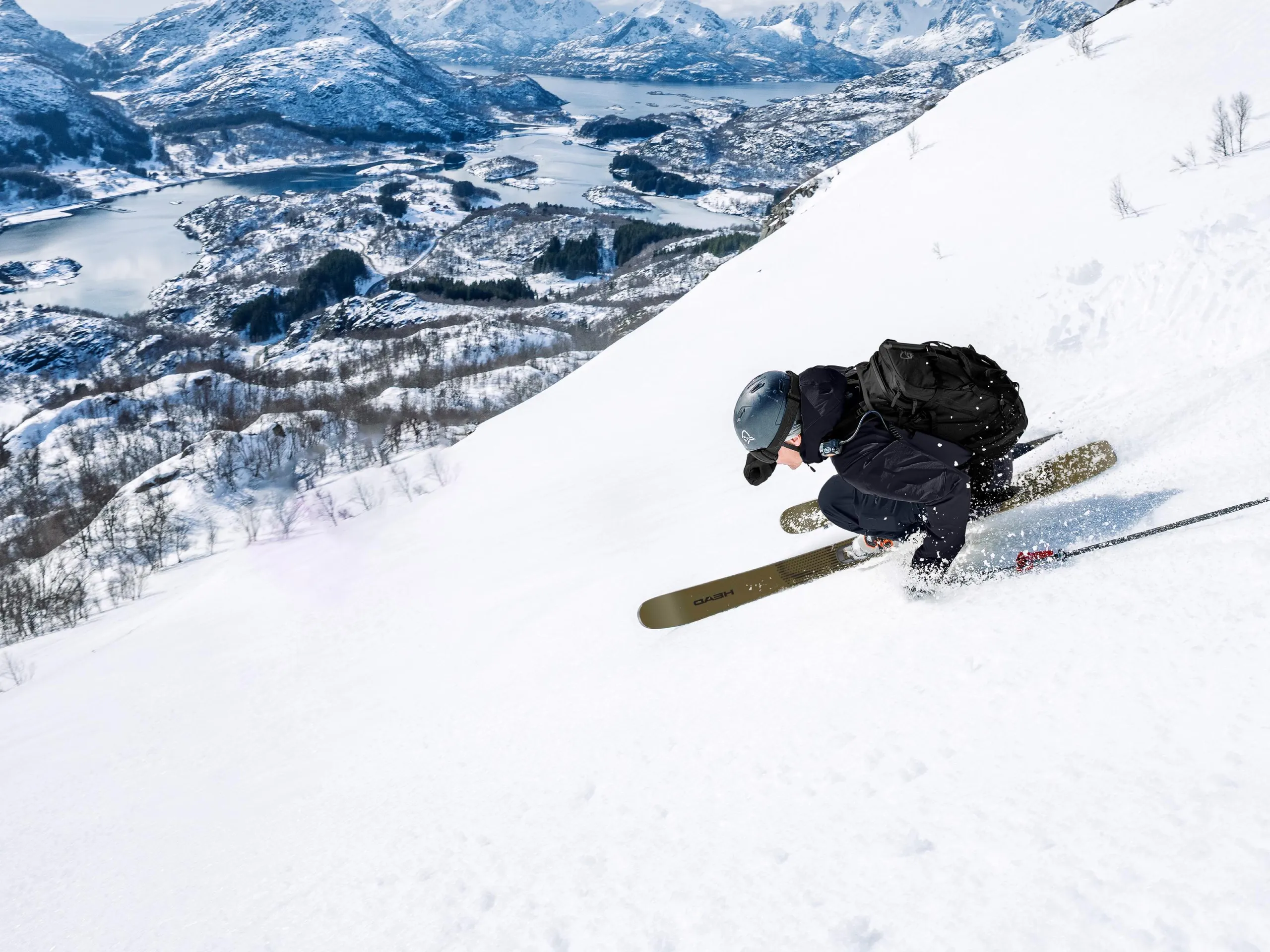 A skier on the slopes wearing Porsche ski gear.
